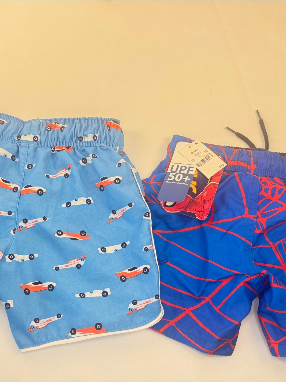 Boys Blue Racing & Spider Web Swim Trunks - Two Pack
One pair (NWT)spiderman